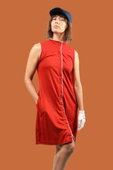 Women's golfer in sustainably made golf dress in red color