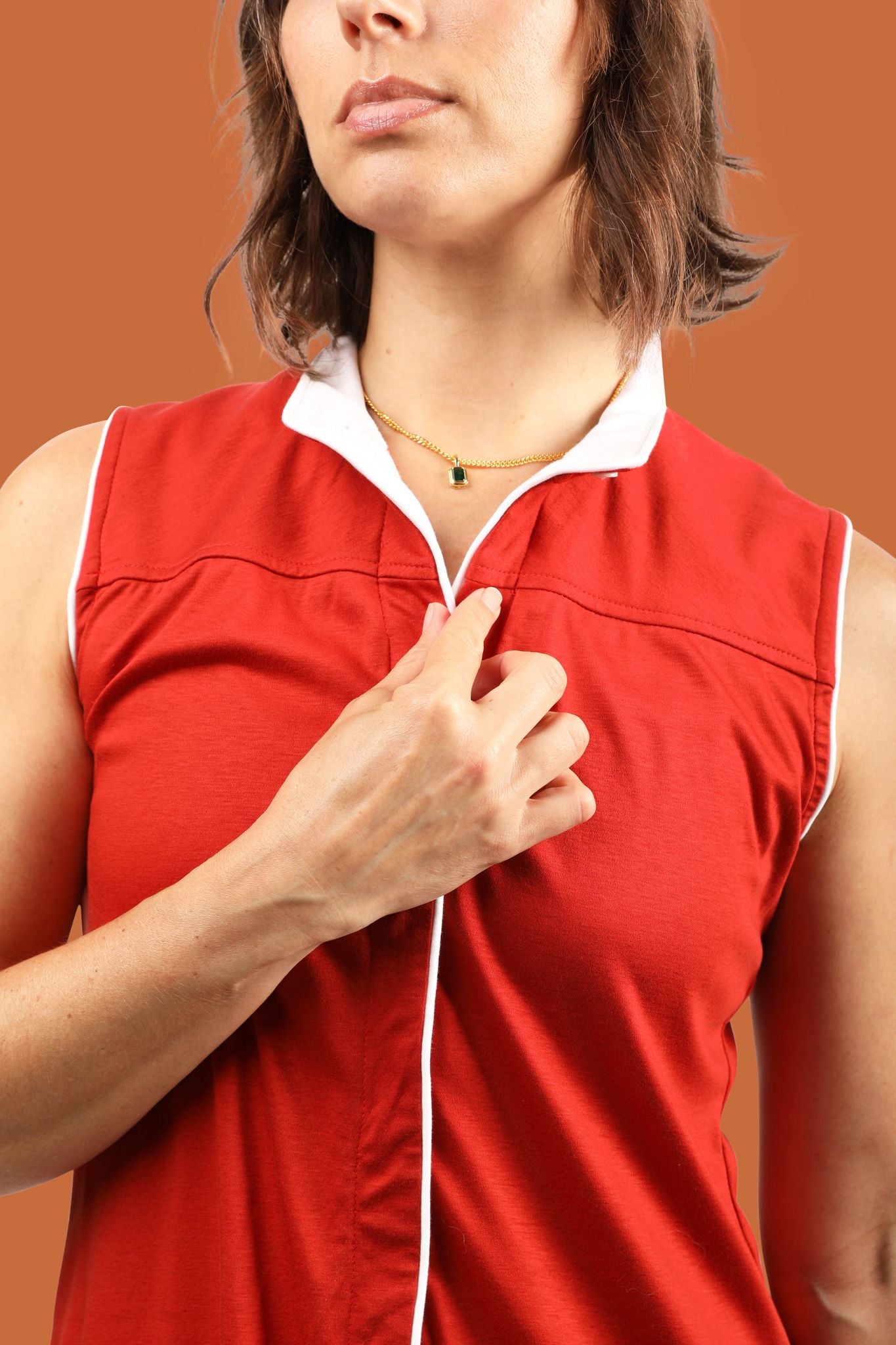 Women's golfer in sustainably made golf dress in red color