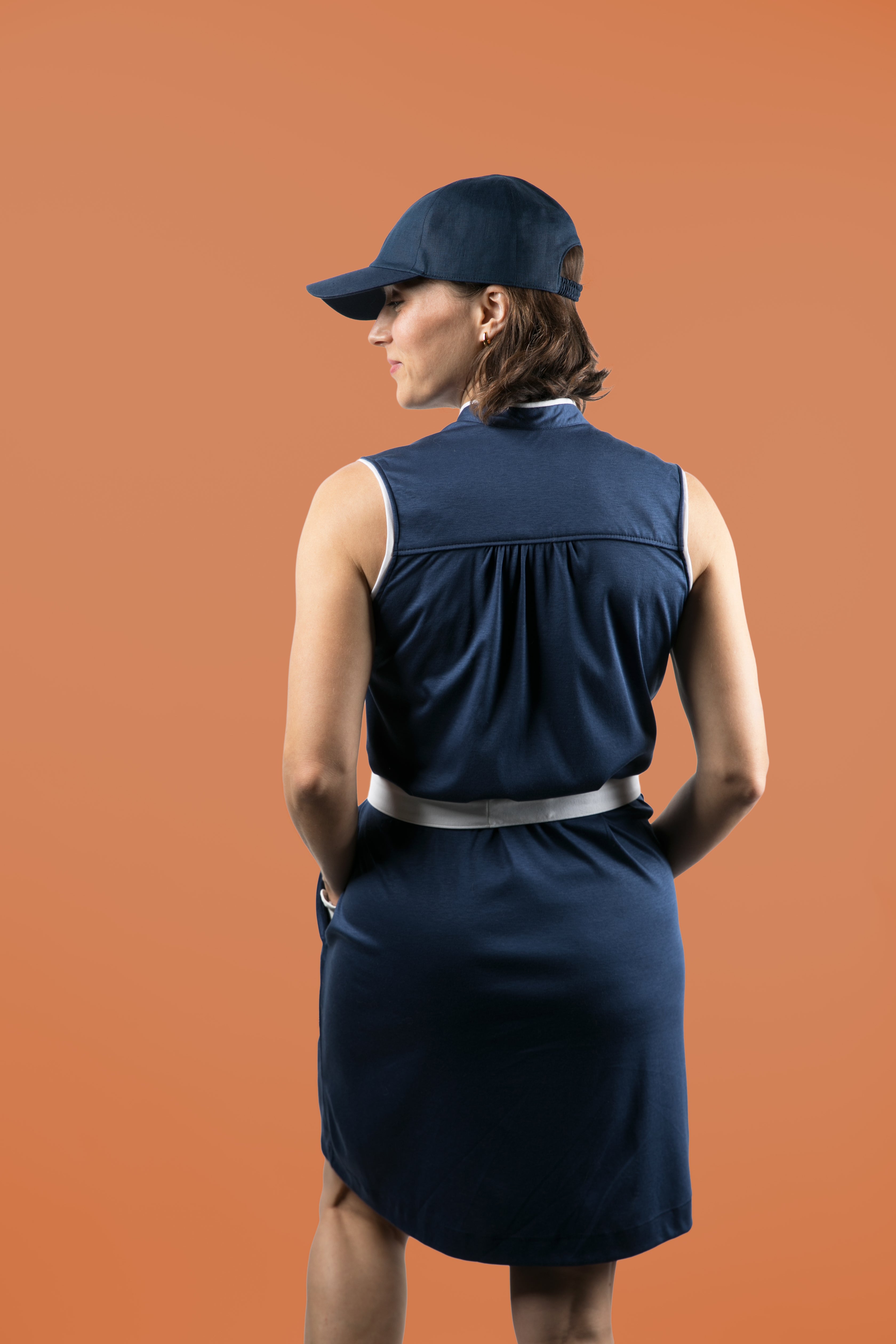 Women's golfer in sustainably made golf dress